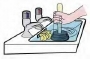 plumber unblocking a sink